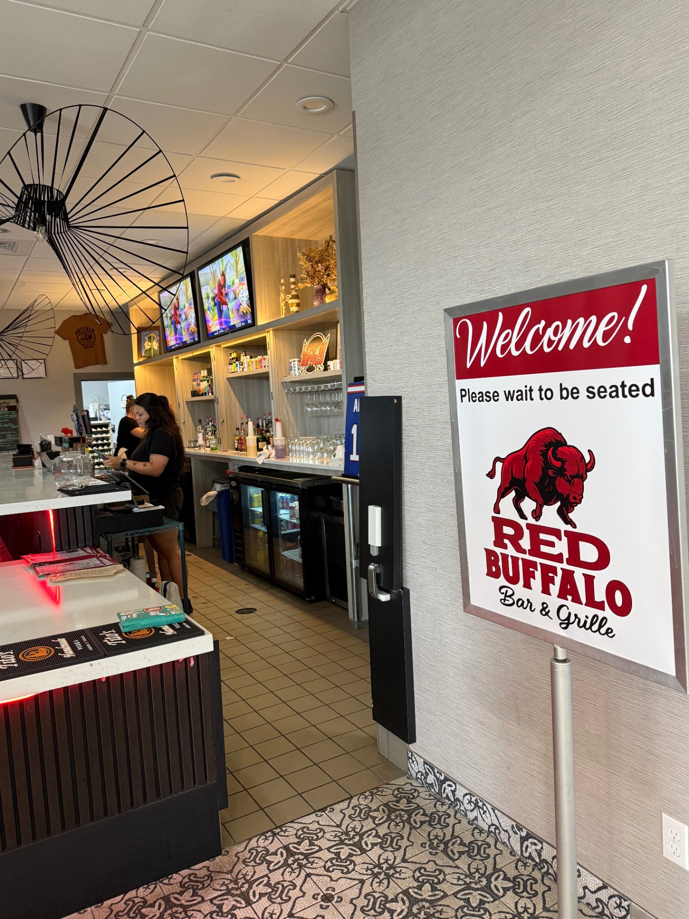 Welcome sign at the entrance of Red Buffalo Bar & Grille